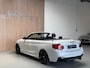 BMW 2-Serie Cabrio M235i - AUTOMAAT - PARELMOER WIT - LEER - NAVIGATIE - HARMAN KARDON - M PERFORMANCE UITLAAT