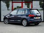 Volkswagen Golf Sportsvan 1.4 TSI Highline | Trekhaak | Camera | Navigatie | Stoelverwarming | Dode Hoek Detectie | Climate Control | Cruise Control | Metallic Lak | All Season Banden | 17'' Lichtmetalen Velgen |