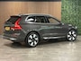Volvo XC60 T8 AWD Recharge Ultra Bright | Luchtvering | Trekhaak | 360° Camera | 455pk | Head-Up Display | Adaptieve Cruise Control | Stoelverwarming voor+achter | Stuurwielverwarming | Schuifdak | Full LED Meesturende koplampen | Pilot Assist | BLIS Dode Hoek Detectie | Elektrische voorstoelen geheugen | Lederen bekleding | Zitting verlenging voorstoelen | Lederen dashboard | 20 Inch | Google Infotainment | Keyless Drive | Elektrisch bedienbare achterklep | DAB Radio | Apple Carplay/Android Auto | Alarm Klasse III | Draadloos telefoon opladen | Volvo On Call met mobiele App functie | Platinum Grey Metallic |