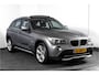 BMW X1 sDrive20i 184 PK - Automaat Orig. NL | Luxery-Line | S/K Panodak | Trekhaak | Cruise | PDC | NAV | Auto.Airco | LM 18" |
