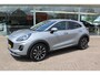 Ford Puma 1.0-125pk EcoBoost Mild-Hybrid Titanium X. Garantie t/m 07-03-2028 ! Slechts 7.400km ! Cruise cntrl, climate cntrl, stoel-, stuur- en voorraamverw., draadloos opladen telefoon, trekhaak afneembaar, navigatie, telefoonvoorb., LM wielen, B&O soundsyst., digitaal dashboard etc.