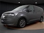 Volkswagen Multivan 1.4 eHybrid L2H1 Style | Pano Dak | Trekhaak | Camera | Elek. Achterklep | Parkeerhulp | Matrix LED | Spiegelpakket | Getint Glas | 18'' |