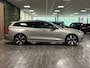 Volvo V60 T8 AWD Recharge Ultra Dark | Trekhaak | Schuifdak | 455pk | Head-Up Display | Harman Kardon | Adaptieve Cruise Control | Stoelverwarming voor+achter | Stuurwielverwarming | Full LED Meesturende koplampen | Parkeercamera | Pilot Assist | BLIS Dode Hoek Detectie | Parkeercamera | Elektrische voorstoelen geheugen | Lederen bekleding | Zitting verlenging voorstoelen | Lederen dashboard | 19 Inch | Google Infotainment | Keyless Drive | Parkeersensoren voor+achter | Privacy Glass | Elektrisch bedienbare achterklep | DAB Radio | Apple Carplay/Android Auto | Volvo On Call met mobiele App functie | Silver Dawn Metallic |