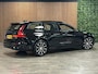 Volvo V60 T6 AWD Recharge Plus Dark | Trekhaak | 360° Camera | All Season banden | Harman Kardon | Adaptieve Cruise Control | Stoelverwarming voor+achter | Stuurwielverwarming | Pilot Assist | BLIS Dode Hoek Detectie | Elektrische voorstoelen geheugen | R-Design Contour stoelen met wit stiksel en bies | Zitting verlenging voorstoelen | 18 Inch | Google Infotainment | Keyless Drive | Parkeersensoren voor+achter | Elektrisch bedienbare achterklep | DAB Radio | Apple Carplay/Android Auto | Volvo On Call met mobiele App functie | Onyx Black Metallic |