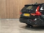 Volvo V60 T6 AWD Recharge Plus Dark | Trekhaak | 360° Camera | All Season banden | Harman Kardon | Adaptieve Cruise Control | Stoelverwarming voor+achter | Stuurwielverwarming | Pilot Assist | BLIS Dode Hoek Detectie | Elektrische voorstoelen geheugen | R-Design Contour stoelen met wit stiksel en bies | Zitting verlenging voorstoelen | 18 Inch | Google Infotainment | Keyless Drive | Parkeersensoren voor+achter | Elektrisch bedienbare achterklep | DAB Radio | Apple Carplay/Android Auto | Volvo On Call met mobiele App functie | Onyx Black Metallic |