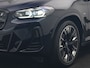 BMW X3 M iX3 Sport 80 kWh 286pk Dealer O.H. | Trekhaak Af Fabriek | Panodak | Head Up | Adaptive Cruise | 360 Camera | Adaptief Onderstel | Harman / Kardon | Lederen Sportstoelen Memory & Verwarmd | Keyless | Blis | Apple Carplay | Sfeerverlichting | Navigatie | DAB | 20"L.M |