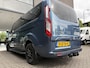 Ford Transit Custom 320 2.0 TDCI L2H1 Platinum Edition DC Automaat Achteruitrijcamera - Parkeersensoren - Navigatie - Airco - Dodehoek detector - Cruise control - Licht metalen velgen 16 inch - Lederen bekleding - Radio - Bluetooth - Dubbele cabine - Tussens - Mistlampen voor - Sidebars - Trekhaak - Voorstoelen verwarmd - Led verlichting - Extra getint glas achter - Start/stop systeem - Stuur multifunctioneel - Stuur leder - Regensensor