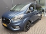 Ford Transit Custom 320 2.0 TDCI L2H1 Platinum Edition DC Automaat Achteruitrijcamera - Parkeersensoren - Navigatie - Airco - Dodehoek detector - Cruise control - Licht metalen velgen 16 inch - Lederen bekleding - Radio - Bluetooth - Dubbele cabine - Tussens - Mistlampen voor - Sidebars - Trekhaak - Voorstoelen verwarmd - Led verlichting - Extra getint glas achter - Start/stop systeem - Stuur multifunctioneel - Stuur leder - Regensensor