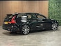 Volvo V60 T6 AWD Recharge Plus Dark | Trekhaak | 360° Camera | All Season banden | Harman Kardon | Adaptieve Cruise Control | Stoelverwarming voor+achter | Stuurwielverwarming | Pilot Assist | BLIS Dode Hoek Detectie | Elektrische voorstoelen geheugen | R-Design Contour stoelen met wit stiksel en bies | Zitting verlenging voorstoelen | 18 Inch | Google Infotainment | Keyless Drive | Parkeersensoren voor+achter | Elektrisch bedienbare achterklep | DAB Radio | Apple Carplay/Android Auto | Volvo On Call met mobiele App functie | Onyx Black Metallic |