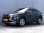 Hyundai Tucson 1.6 T-GDI HEV Premium / Fabrieksgarantie tot 09-2029 / Dealer onderhouden / 1.360 kg Afn. trekhaak / Leder / Elektrische stoelen en klep / Stuur-, stoel- en achterbankverwarming / Stoelventilatie / Camera 360° /
