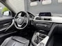BMW 3-Serie Touring 320d Upgrade Edition | Navigatie | Lederen Bekleding | Airco | Lichtmetalen Velgen |
