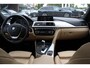 BMW 3-Serie 320i Corporate Lease High Executive / Trekhaak / Schuifdak / Leder / Navigatie / Parkeerhulp V+A / 16'' / Getint glas / Stoelverwarming / Cruise Control