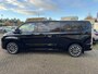 Ford Tourneo Custom 340 2.5 PHEV L2H1 Titanium X 233pk | 16-weg elek. AGR-stoel | Handsfree elek. dubbele zijschuifdeuren | Panoramadak | 15 B&O speaker | Inklapbare trekhaak | Verwarmbaar stuurwiel | Verwarmbare en elek. verstelbare stoelen tweede zitrij | Draadloos opladen | Prijs ex. BTW incl. BPM |  Prijs Incl. BTW en BPM 70.400