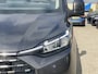 Ford Tourneo Custom 340 2.5 PHEV L2H1 Titanium X 233pk ZUID | 16-weg elek. AGR-stoel | Handsfree elek. dubbele zijschuifdeuren | Panoramadak | 15 B&O speaker | Inklapbare trekhaak | Verwarmbaar stuurwiel | Verwarmbare en elek. verstelbare stoelen tweede zitrij | Draadloos opladen | Prijs ex. BTW incl. BPM | Prijs Incl. BTW en BPM 70.400