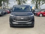 Ford Tourneo Custom 340 2.5 PHEV L2H1 Titanium X 233pk ZUID | 16-weg elek. AGR-stoel | Handsfree elek. dubbele zijschuifdeuren | Panoramadak | 15 B&O speaker | Inklapbare trekhaak | Verwarmbaar stuurwiel | Verwarmbare en elek. verstelbare stoelen tweede zitrij | Draadloos opladen | Prijs ex. BTW incl. BPM | Prijs Incl. BTW en BPM 70.400