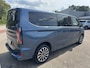 Ford Tourneo Custom 340 2.5 PHEV L2H1 Titanium X SCI| 233pk | 16-weg elek. AGR-stoel | Handsfree elek. dubbele zijschuifdeuren | Panoramadak | 15 B&O speaker | Inklapbare trekhaak | Verwarmbaar stuurwiel | Verwarmbare en elek. verstelbare stoelen tweede zitrij | Draadloos opladen | Prijs ex. BTW incl. BPM | Prijs Incl. BTW en BPM 70.400