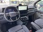 Ford Tourneo Custom 340 2.5 PHEV L2H1 Titanium X 233pk | 16-weg elek. AGR-stoel | Handsfree elek. dubbele zijschuifdeuren | Panoramadak | 15 B&O speaker | Inklapbare trekhaak | Verwarmbaar stuurwiel | Verwarmbare en elek. verstelbare stoelen tweede zitrij | Draadloos opladen | Prijs ex. BTW incl. BPM | Prijs Incl. BTW en BPM 70.400