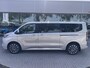 Ford Tourneo Custom 340 2.5 PHEV L2H1 Titanium X 233pk | 16-weg elek. AGR-stoel | Handsfree elek. dubbele zijschuifdeuren | Panoramadak | 15 B&O speaker | Inklapbare trekhaak | Verwarmbaar stuurwiel | Verwarmbare en elek. verstelbare stoelen tweede zitrij | Draadloos opladen | Prijs ex. BTW incl. BPM | Prijs Incl. BTW en BPM 70.400