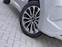 Ford Tourneo Custom 340 2.5 PHEV L2H1 Titanium X 233pk | 16-weg elek. AGR-stoel | Handsfree elek. dubbele zijschuifdeuren | Panoramadak | 15 B&O speaker | Inklapbare trekhaak | Verwarmbaar stuurwiel | Verwarmbare en elek. verstelbare stoelen tweede zitrij | Draadloos opladen | Prijs ex. BTW incl. BPM | Prijs Incl. BTW en BPM 70.400