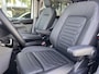 Ford Tourneo Custom 340 2.5 PHEV L2H1 Titanium X 233pk | 16-weg elek. AGR-stoel | Handsfree elek. dubbele zijschuifdeuren | Panoramadak | 15 B&O speaker | Inklapbare trekhaak | Verwarmbaar stuurwiel | Verwarmbare en elek. verstelbare stoelen tweede zitrij | Draadloos opladen | Prijs ex. BTW incl. BPM | Prijs Incl. BTW en BPM 70.400