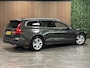 Volvo V60 B4 Aut. Business Edition | Trekhaak | Pine Grey! | Adaptieve Cruise Control | Stoel en Stuurwielverwarming | Parkeercamera | Pilot Assist | BLIS Dode Hoek Detectie | Lederen bekleding | Zitting verlenging voorstoelen | 17 Inch | Keyless Drive | Privacy Glass | 4-Voudig verstelbare lendesteun elektrisch | Parkeersensoren voor+achter | Elektrisch bedienbare achterklep | Draadloos telefoon opladen | DAB Radio | Apple Carplay/Android Auto | Climate Control L+R | Volvo On Call met mobiele App functie | Pine Grey Metallic |