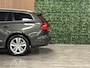 Volvo V60 B4 Aut. Business Edition | Trekhaak | Pine Grey! | Adaptieve Cruise Control | Stoel en Stuurwielverwarming | Parkeercamera | Pilot Assist | BLIS Dode Hoek Detectie | Lederen bekleding | Zitting verlenging voorstoelen | 17 Inch | Keyless Drive | Privacy Glass | 4-Voudig verstelbare lendesteun elektrisch | Parkeersensoren voor+achter | Elektrisch bedienbare achterklep | Draadloos telefoon opladen | DAB Radio | Apple Carplay/Android Auto | Climate Control L+R | Volvo On Call met mobiele App functie | Pine Grey Metallic |