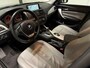 BMW 1-Serie 116i Business+ (PANO, LEER, LED, CRUISE, H&K AUDIO, PARKEERSENSOREN)