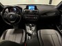 BMW 1-Serie 116i Business+ (PANO, LED, STOELVERWARMING, NAVI, TREKHAAK, HALF LEDER)