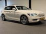 BMW 1-Serie 116i Business+ (PANO, LED, STOELVERWARMING, NAVI, TREKHAAK, HALF LEDER)