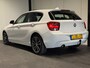 BMW 1-Serie 116i Business+ (PANO, LED, STOELVERWARMING, NAVI, TREKHAAK, HALF LEDER)