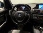 BMW 1-Serie 116i Business+ (PANO, LED, STOELVERWARMING, NAVI, TREKHAAK, HALF LEDER)