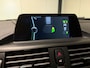 BMW 1-Serie 116i Business+ (PANO, LED, STOELVERWARMING, NAVI, TREKHAAK, HALF LEDER)
