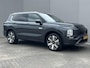 Mitsubishi Outlander 2.4 PHEV Instyle / 8 jaar Fabrieksgarantie / Trekhaak (1.600KG) / Panoramadak / Elektr. Voorstoelen Met Geheugen / Stoel Verwarming Voor & Achter / Stuur & Voorruit Verwarming / Elektr. Achterklep / Apple Carplay & Android Auto / Navigatie / Airco / Dodehoek Detectie /