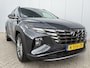 Hyundai Tucson 1.6 T-GDI MHEV Comfort Smart / Android Auto/Apple Carplay / Lederen Bekleding / Navigatie / Climate Control / Camera / Cruise Control / Draadloze Telefoonlader / Elektrische Stoel / Stoelverwarming / Lane Assist / Krell Audio / DAB /