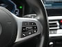 BMW 3-Serie Touring 330e Sportline PHEV 293pk Dealer O.H. | Dravitgrau | Trekhaak Af Fabriek | Adaptive Cruise | Laser LED | Head Up | Adaptief Onderstel | Camera | Sportstoelen Verwarmd | Sfeerverlichting | Keyless | Blis | Apple Carplay | 19"L.M | Plug In Hybrid |