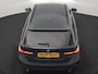 BMW 3-Serie Touring 330e Sportline PHEV 293pk Dealer O.H. | Dravitgrau | Trekhaak Af Fabriek | Adaptive Cruise | Laser LED | Head Up | Adaptief Onderstel | Camera | Sportstoelen Verwarmd | Sfeerverlichting | Keyless | Blis | Apple Carplay | 19"L.M | Plug In Hybrid |