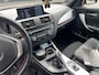 BMW 1-Serie 116i Sport-Line Business+ | 1e eig. | NAP | Navi Prof. | 18" BMW LM velg sterspaak 379 | Schuifdak | Bi-Xenon | M-Sport onderstel