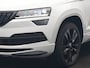 Skoda Karoq 1.5 TSI ACT Sportline DSG 150pk Dealer O.H | Panodak | Adaptive Cruise | Camera | RS Sportstoelen Verwarmd | Blis | Keyless | Apple Carplay | Black Optic | Virtual | Navigatie | DAB | 18"L.M |