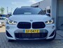 BMW X2 sDrive20i High Executive M-SPORT - PANO - HUD - TREKHAAK - LEER - CAMERA - PDC V/A - STOELVERW -