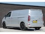 Ford E-Transit Custom L2H1 218Pk Aut. | Elektrisch | Limited 340 | 2xSchuifdeur | Spoilerpack | 360° Camera | 19'' | Moondust Silver