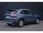 Ford Kuga 1.5 EcoBoost Titanium X | 100% dealer o.h. | Panoramadak | Adaptieve cruise | Trekhaak | Privay glass | Helf leder | B&O Audio | Camera  | 1800kg trekgewicht