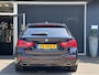 BMW 5-Serie Touring 520i High Executive M-SPORT / PANO / MEMORY / TREKHAAK