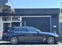 BMW 5-Serie Touring 520i High Executive M-SPORT / PANO / MEMORY / TREKHAAK
