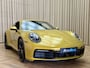 Porsche 992 911 3.0 Carrera S / 450 PK / Paint to Sample / PTS Yellow Storm / 18-way Seats / BOSE / Race-Tex / Alcantara / ACC / Sportuitlaat