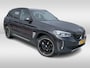 BMW iX3 High Executive 80 kWh / Panoramadak / Camera / Head-up / 20'' / Leder / Harman Kardon / Navigatie / Memory seats / Dodehoek / DAB / Stoelverwarming / Cruise Control Adaptief