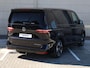 Volkswagen Multivan Bulli Edition L2 1.5 eHybrid EU6 180 kW 245pk | 2 Persoons bed | 7 Zits | Navigatie | Trekhaak | Panorama dak | 19 inch Lm velgen | ACC | Apple Carplay | Elek. bedienb. Schuifdeuren en achterklep | IQ Light |