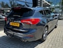 Ford Focus Wagon 1.5 150 PK Automaat ST Line X | TREKHAAK| LEDER| STUUR, STOEL EN VOORRUITVERWARMING| NAVIGATIE + APPLE CARPLAY/ANDROID AUTO| CAMERA + PARKEERSENSOREN| ELEK. KOFFERKLEP| DRAADLOZE TELEFOONLADER| DAB|