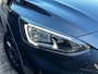 Ford Focus Wagon 1.5 150 PK Automaat ST Line X | TREKHAAK| LEDER| STUUR, STOEL EN VOORRUITVERWARMING| NAVIGATIE + APPLE CARPLAY/ANDROID AUTO| CAMERA + PARKEERSENSOREN| ELEK. KOFFERKLEP| DRAADLOZE TELEFOONLADER| DAB|