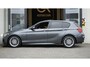 BMW 1-Serie 118i M Sport Shadow Line AUTOMAAT|CRUISE|FULL LED|LEDER|NAVIGATIE|PANORAMA|STOELVERWARMING|TREKHAAK