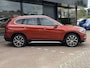 BMW X1 sDrive20i Orange Edition II AUTOMAAT| LEDER SPORT INTERIEUR| PANORAMADAK| CAMERA| NAVIGATIE| AIRCO/ECC | CRUISECONTROL| TREKHAAK| PARKEERSENSOREN